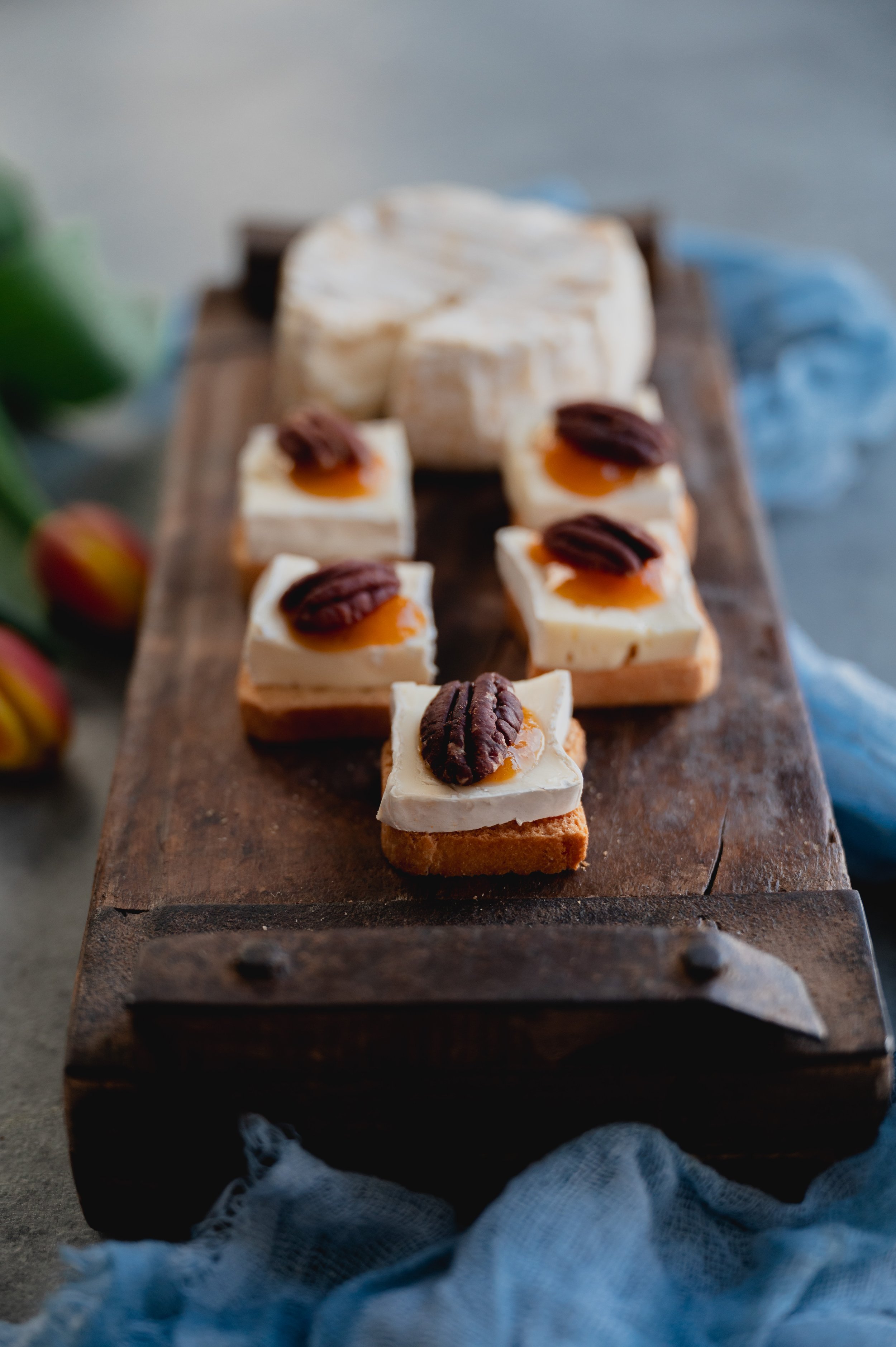 Brie and Apricot Jam Bites with Pecan on Paris Toasts